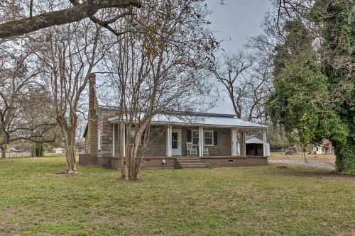 a small house with a porch in a yard at 2 Mi to Lake Hartwell Charming Southern Cottage in Anderson