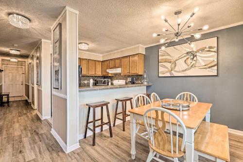 a kitchen and dining room with a table and chairs at 2 Mi to Skiing! Resort-Style Beech Mountain Condo in Beech Mountain