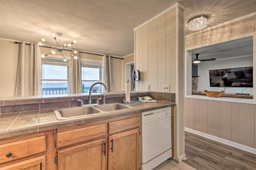 a kitchen with a sink and a dishwasher at 2 Mi to Skiing! Resort-Style Beech Mountain Condo in Beech Mountain