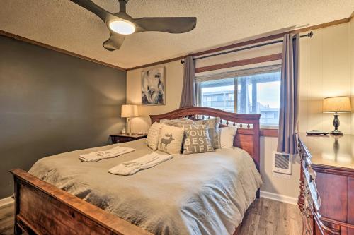 a bedroom with a bed with two towels on it at 2 Mi to Skiing! Resort-Style Beech Mountain Condo in Beech Mountain