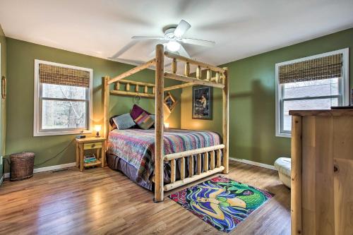 a bedroom with green walls and a wooden bunk bed at Lake Michigan Gem Less Than Half-Mi to Private Beach! in Mears