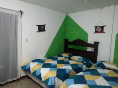 Postel nebo postele na pokoji v ubytování Casa Familiar