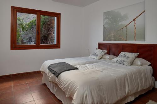 Un pat sau paturi într-o cameră la Casa Naranja