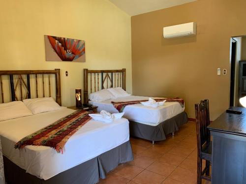 Postel nebo postele na pokoji v ubytování Zafra Hotel