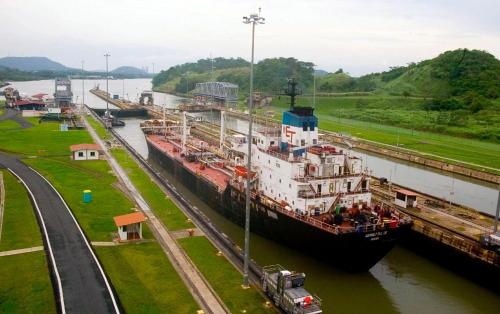 a large ship is docked in a river at Summit Rainforest Golf Resort & All Inclusive in Paraíso