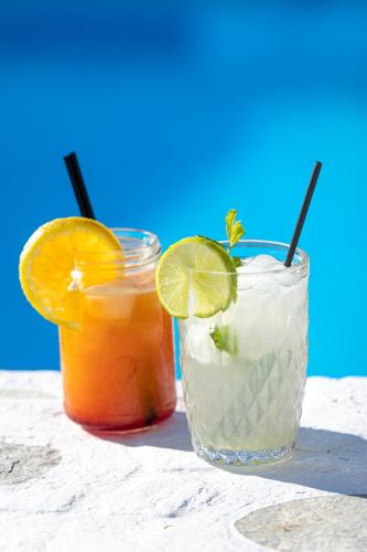 two cocktails sitting on a table next to each other at Akrotiri Hotel in Parikia