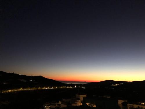 a view of a city at night with the sky at KiCo in Cómpeta