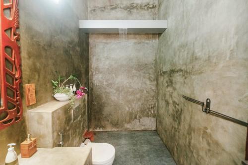 a bathroom with a toilet and a sink at Waterland in Negombo