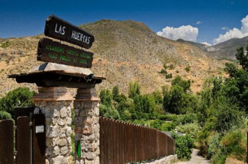 a sign for the us mexicans on a road at Las Huertas in Monachil