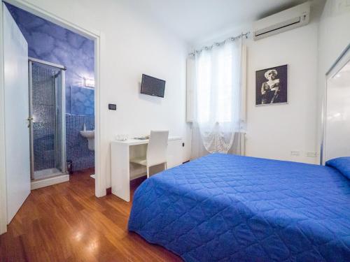 A bed or beds in a room at Villa Bellini Room&Breakfast
