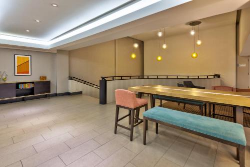 a dining room with a table and chairs at Holiday Inn St Johns by IHG in St. John's