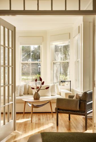 a living room with a couch and a table at AWOL Kennebunkport in Kennebunkport