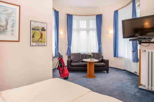 Televisyen dan/atau pusat hiburan di Golfhotel Denzerheide