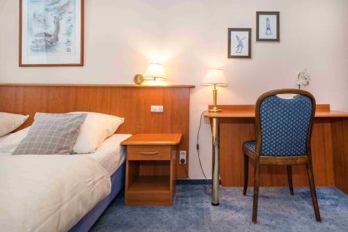 Katil atau katil-katil dalam bilik di Golfhotel Denzerheide