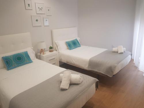 Posteľ alebo postele v izbe v ubytovaní QUATRE CASAS