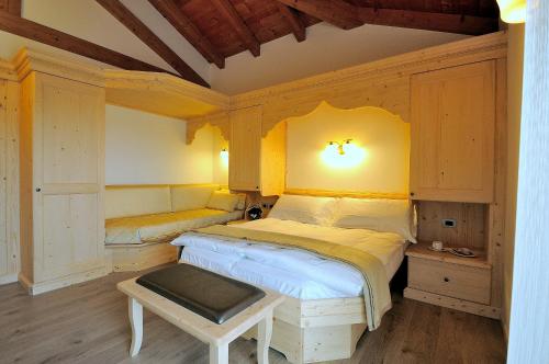 A bed or beds in a room at Agritur Melissa