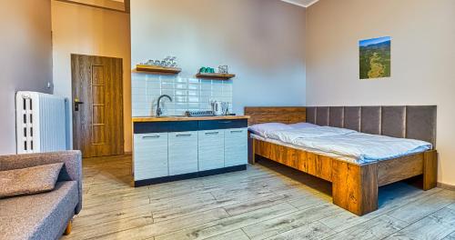 Posteľ alebo postele v izbe v ubytovaní Apartamenty na Deptaku by Royal Aparts
