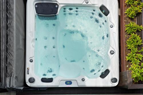 a swimming pool in a box with blue water at Distinctive Alpine Meadows in Queenstown