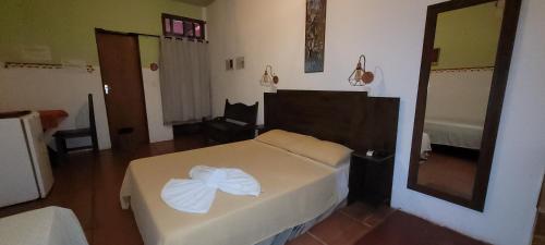 Imbassaí Pousada Hostel Lujimbaにあるベッド