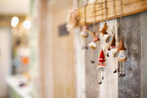a bunch of christmas ornaments hanging on a wall at R&J Guesthouse in Yuanshan