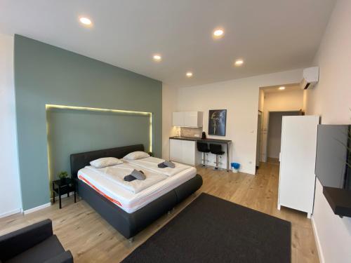 a bedroom with a large bed in a room at Center of Budapest Apartment 3 in Budapest