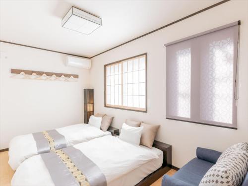 Cama ou camas em um quarto em YADOYA 龍泉寺町