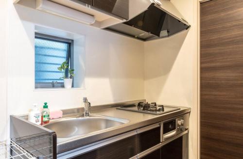 a kitchen with a sink and a window at T-BASE - Vacation STAY 21950v in Tokyo
