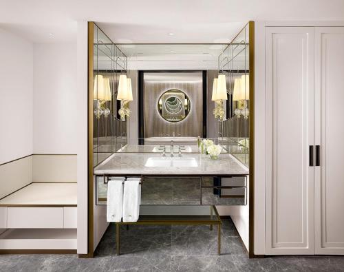 a bathroom with a sink and a mirror at Sofitel Ambassador Seoul Hotel & Serviced Residences in Seoul