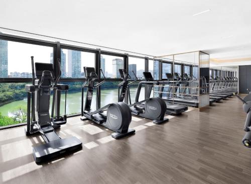 a gym with treadmills and ellipticals in a building at Sofitel Ambassador Seoul Hotel & Serviced Residences in Seoul
