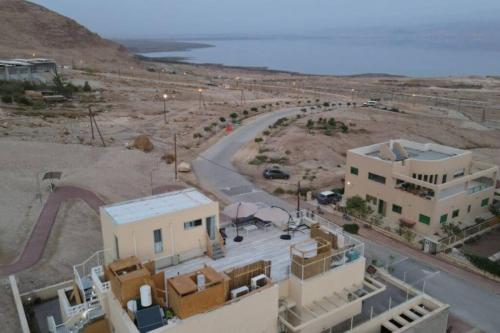 an aerial view of a building and a road at Dead Sea Rooftop - גג ים המלח in Ovnat