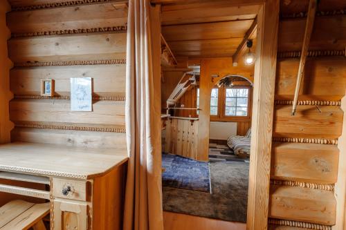 a log cabin with a room with wooden walls at Dom Zako in Zakopane