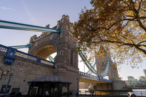 a suspension bridge with a tower in the background at Bob W Tower of London in London