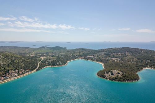 an aerial view of a group of islands in the water at Luxury apartments SKALINADA near beaches, Tisno - Dalmatia in Tisno
