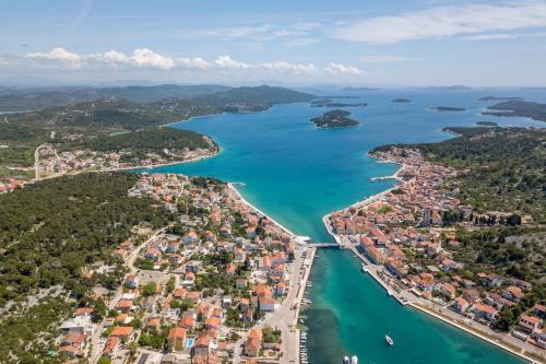 an aerial view of a city and a body of water at Luxury apartments SKALINADA near beaches, Tisno - Dalmatia in Tisno