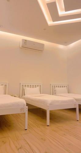 a hospital room with two beds and a ceiling at شاليه دانة بحر in Yanbu