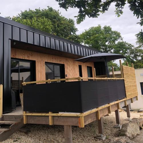 a house being built on top of a wooden platform at Maison chaleureuse et cosy en bois de 2021 Près de Quimper in Ergué-Gabéric