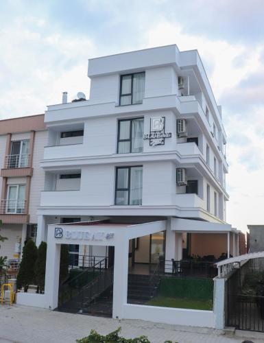 a white building with aventh floor at Blue Ay Boutique Hotel in Atakum