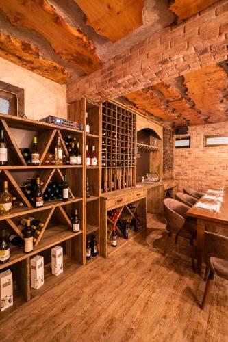 a wine tasting room with wooden walls and wooden floors at Hotel City IN in Kochani