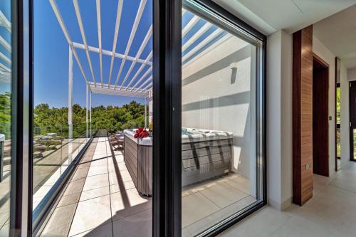 a view from the balcony of a house at Luxury Villa Delight II Promajna with pool, gym, sauna and jacuzzi in Promajna