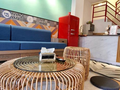 a wicker table with a radio on top of it at MiM House in Hengchun