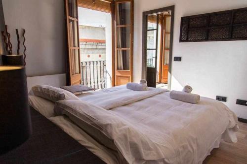 Ένα ή περισσότερα κρεβάτια σε δωμάτιο στο Inspired Apartments Barcelona