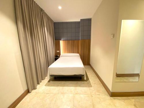 Hotel Camino Realにあるベッド
