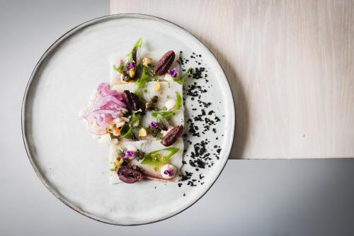 
a plate of food on a table at Boutique Hotel ZIES in Utrecht
