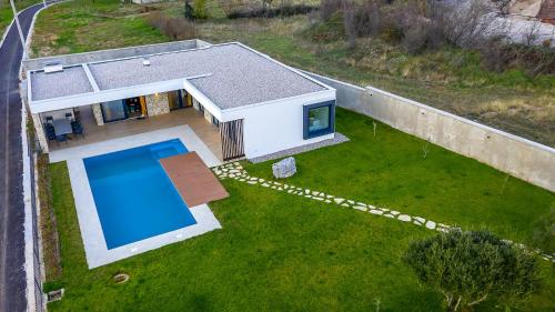 an aerial view of a house with a swimming pool at Villa Nera - Etwa in Mostar