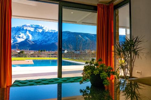 a room with a window with a view of a mountain at Villa Nera - Etwa in Mostar