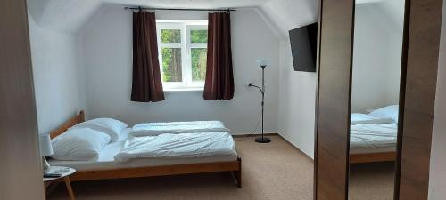 Postel nebo postele na pokoji v ubytování Ubytování v soukromí - Apartmán MERAN