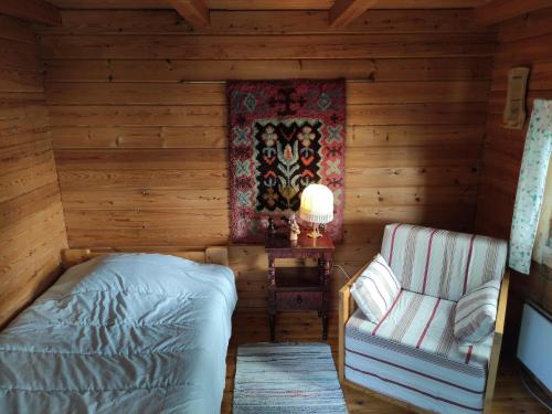 Posteľ alebo postele v izbe v ubytovaní Old Finnish lakeside cottage with sauna