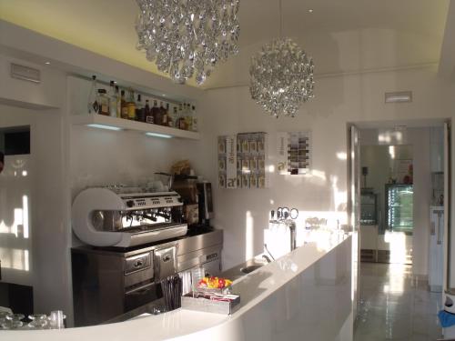 Kuchyň nebo kuchyňský kout v ubytování Plaza Rooms