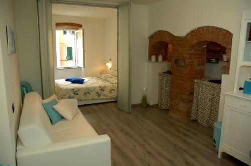 Tempat tidur dalam kamar di La Finestra sul Borgo