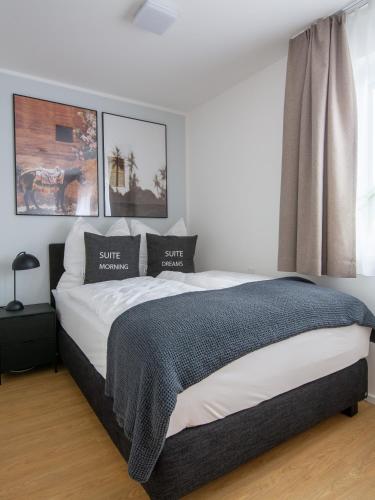 a bedroom with a large bed in a room at Limehome Passau Bahnhofstraße in Passau